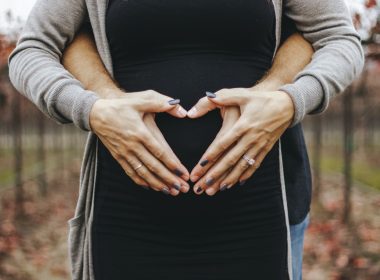 woman touching baby bump