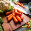 carrots and broccoli on brown wooden chopping board