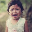 selective focus photography of girl crying