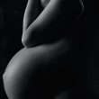 garyscale photography of pregnant woman